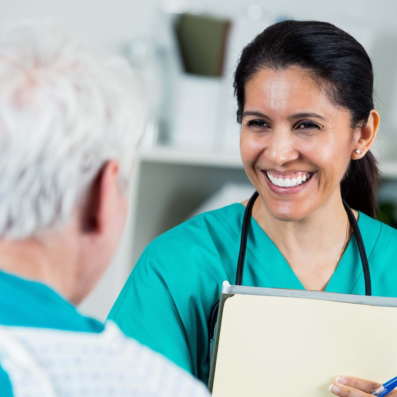 Nurse smiling at patient