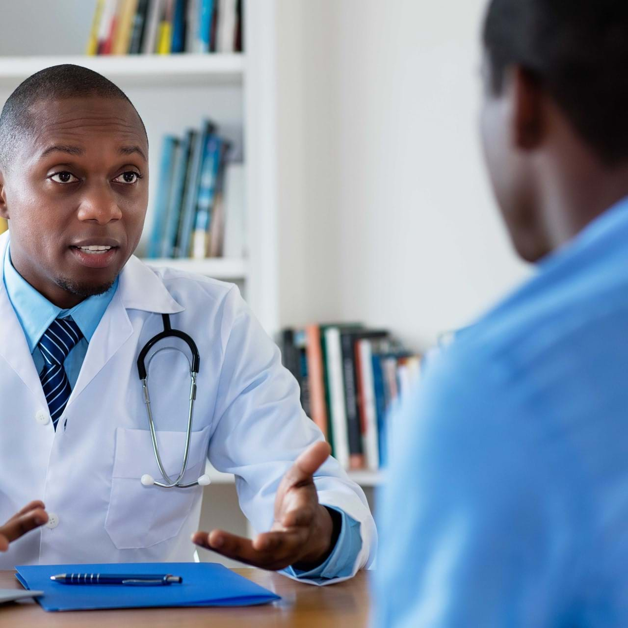 Doctor speaking to patient