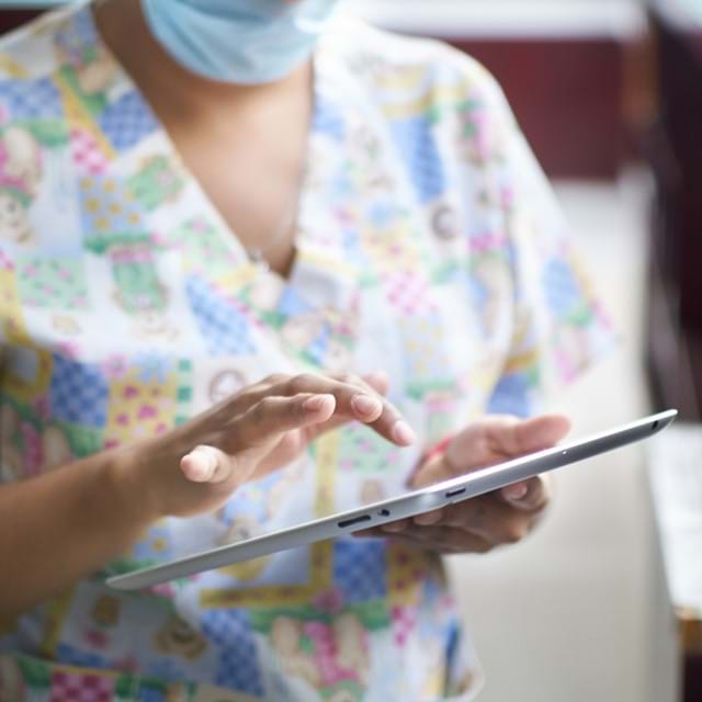 Medical staff using tablet