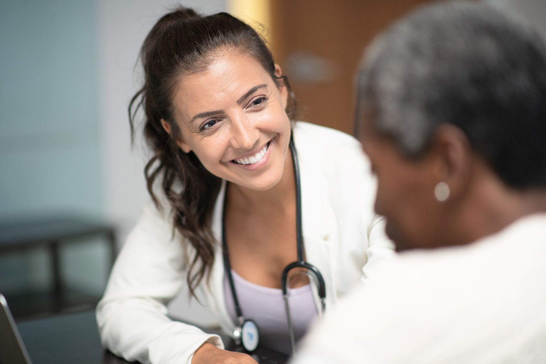 Doctor smiiling at patient